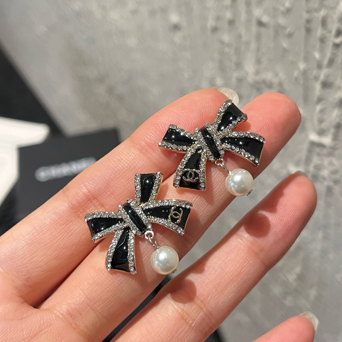 Crystal Bow Pearl Drop Earrings | Black & Silver
