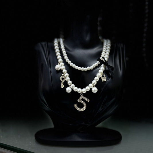 Layered Pearl Charm Necklace | Number Key Lock & Bow Detail