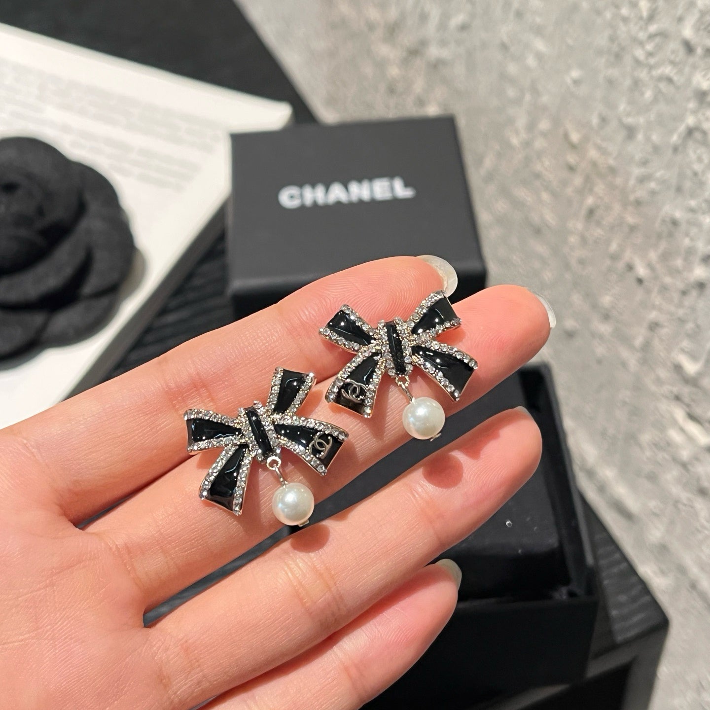 Crystal Bow Pearl Drop Earrings | Black & Silver