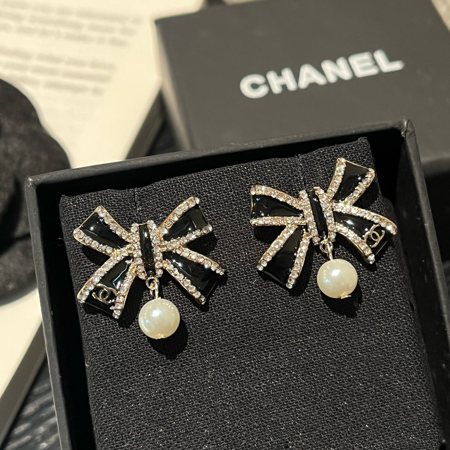 Crystal Bow Pearl Drop Earrings | Black & Silver